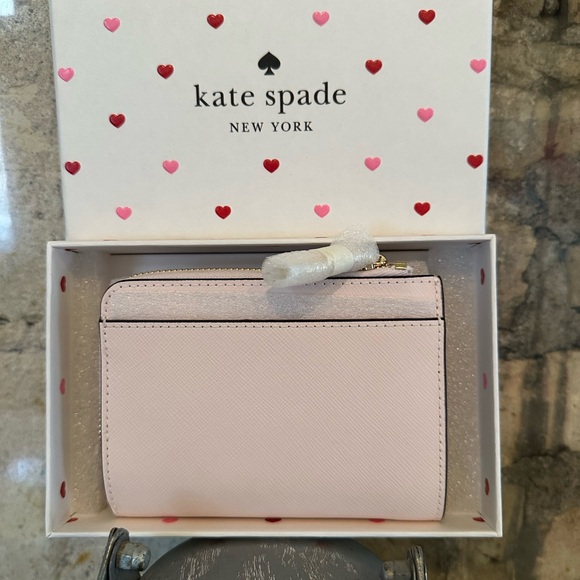 Kate Spade wallet is a light pink wallet adorned with small heart-shaped studs - Picture 6 of 16